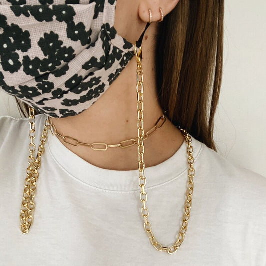 Gold chain attached to floral mask