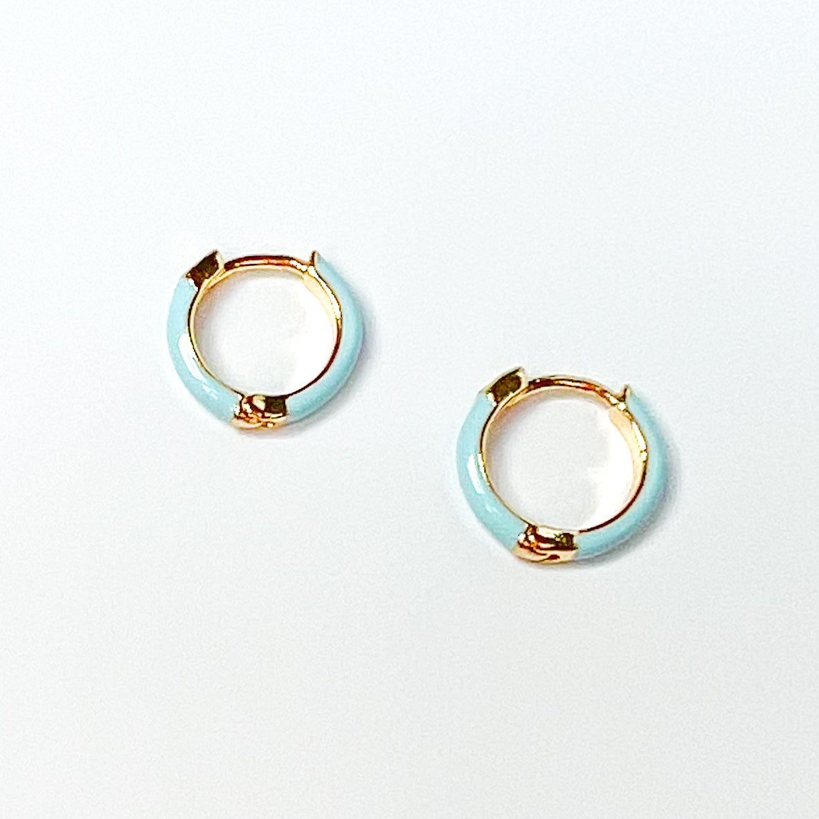 blue enamel huggies. blue hoop earrings. colorful hoops. colorful hoop earrings. enamel hoops. blue huggies. bright earrings, colorful earring trends. blue enamel jewelry. color earrings. fashion jewelry. affordable jewelry. enamel earrings. earring inspo. enamel hoops. fun earrings. earring inspo. blue jewelry. huggie earrings. blue earrings. enamel earring jewelry. blue enamel hoop earrings. fashion earring style. everyday earrings. earring style. earring trends.