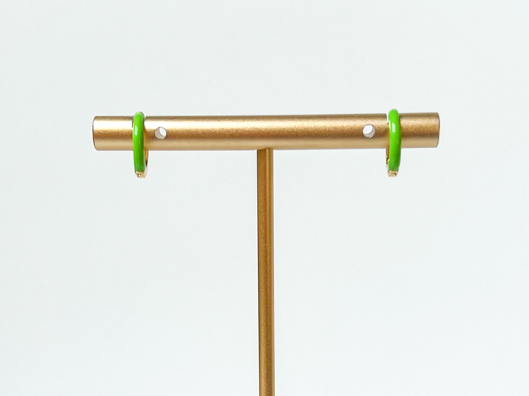 green enamel huggies. green hoop earrings. colorful hoops. colorful hoop earrings. enamel hoops. green huggies. colorful earring trends. green enamel jewelry. color earrings. fashion jewelry. affordable jewelry. enamel earrings. earring inspo. enamel hoops. fun earrings. earring inspo. green jewelry. huggie earrings. enamel green earrings. enamel earring jewelry. green enamel hoop earrings. fashion earring style. everyday earrings. earring style. earring trends.