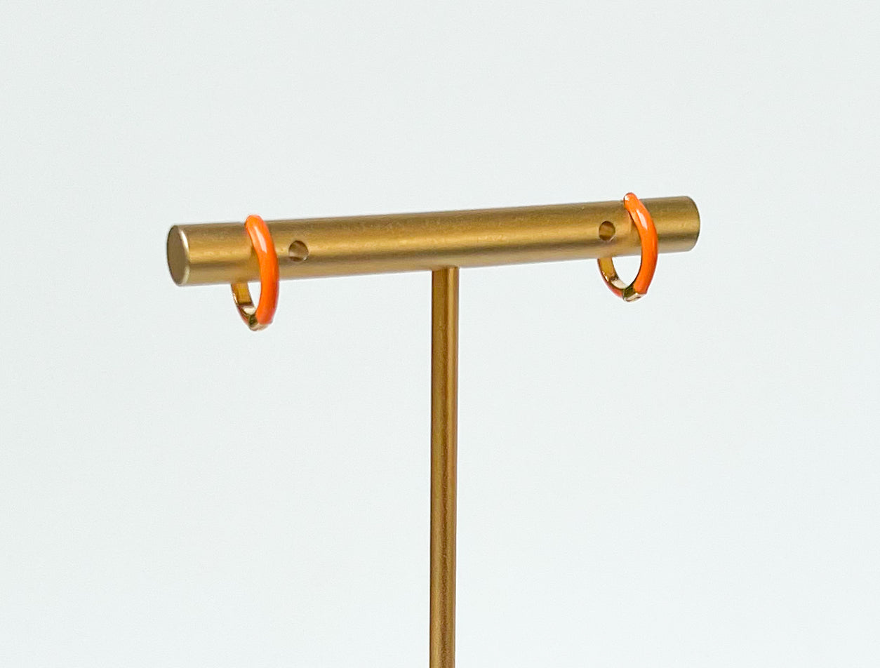 orange enamel huggies. orange hoop earrings. colorful hoops. colorful hoop earrings. enamel hoops. orange huggies. bright earrings, colorful earring trends. orange enamel jewelry. color earrings. fashion jewelry. affordable jewelry. enamel earrings. earring inspo. enamel hoops. fun earrings. earring inspo. orange jewelry. huggie earrings. orange earrings. enamel earring jewelry. orange enamel hoop earrings. fashion earring style. everyday earrings. earring style. earring trends.
