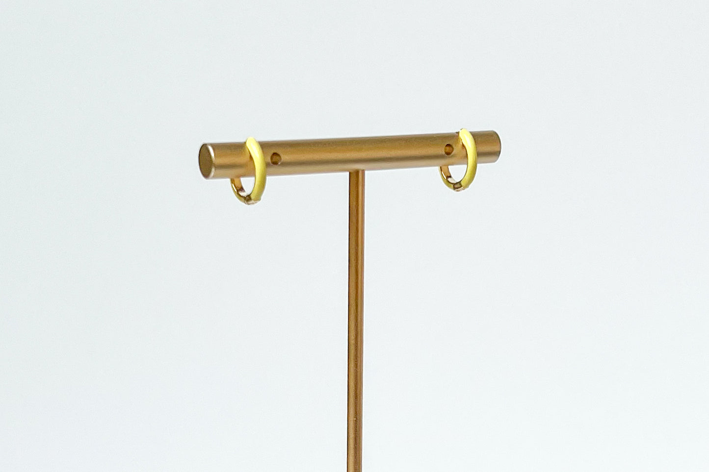 yellow enamel huggies. yellow hoop earrings. colorful hoops. colorful hoop earrings. enamel hoops. yellow huggies. bright earrings, colorful earring trends. yellow enamel jewelry. color earrings. fashion jewelry. affordable jewelry. enamel earrings. earring inspo. enamel hoops. fun earrings. earring inspo. yellow jewelry. huggie earrings. yellow earrings. enamel earring jewelry. yellow enamel hoop earrings. fashion earring style. everyday earrings. earring style. earring trends.