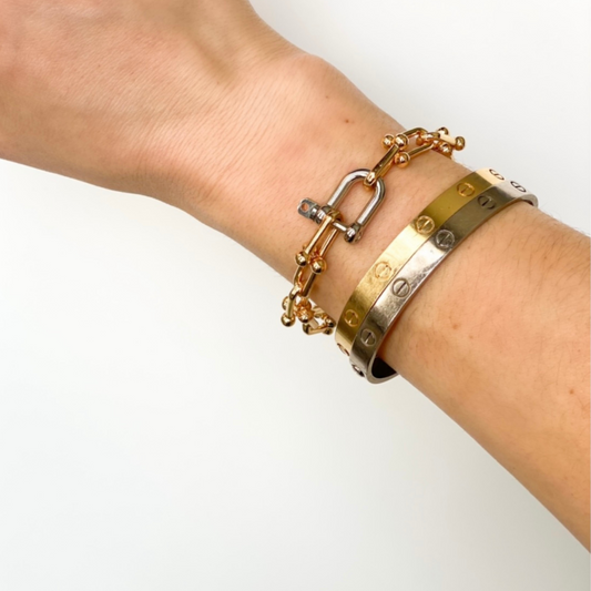 two-tone u link bracelet. gold u link chain with silver shackle clasp