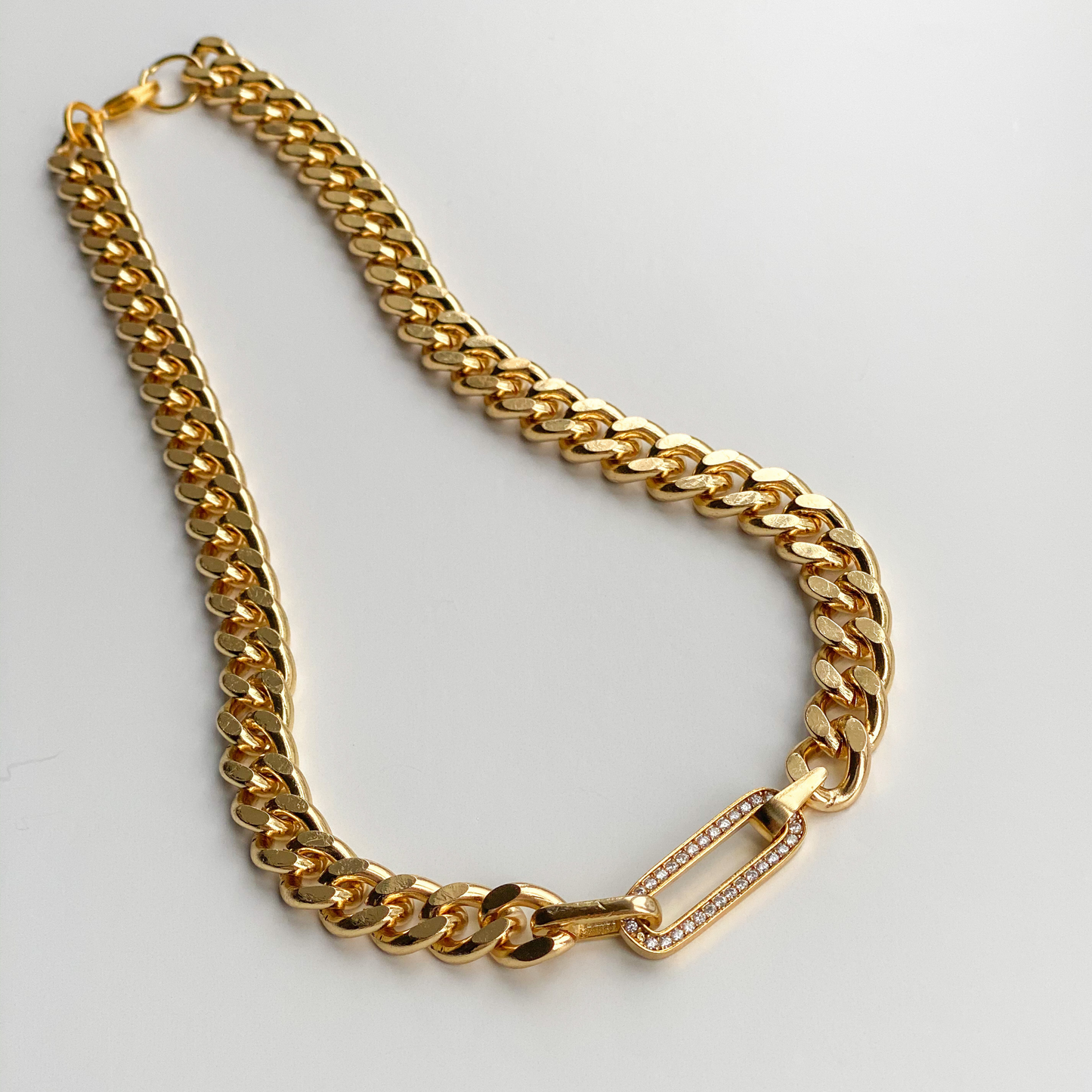 gold curb chain necklace with diamond studded link