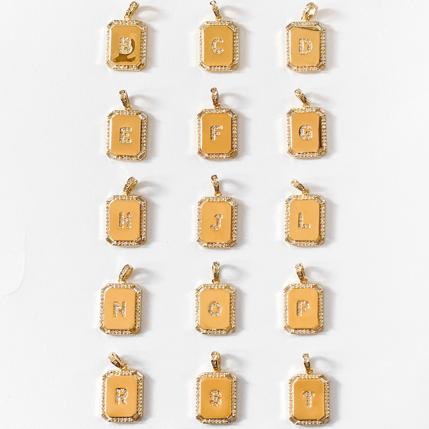 gold and diamond initial tag pendants