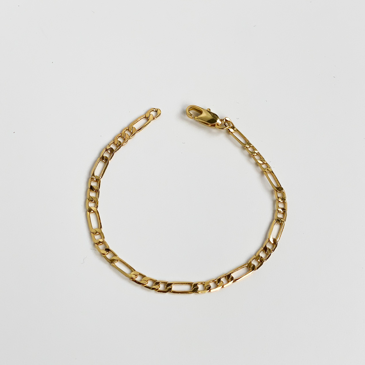 gold figaro chain bracelet