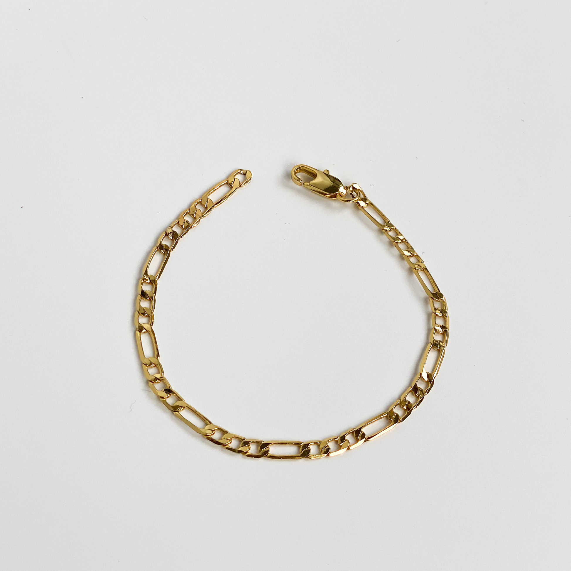 gold figaro chain bracelet