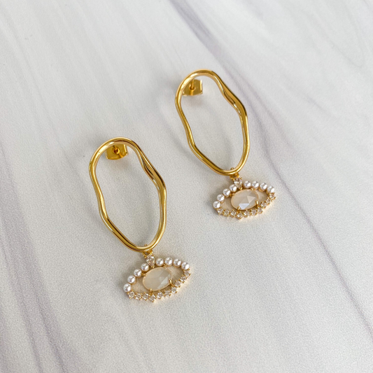 evil eye earrings. gold oval earrings with opal and pearl gold evil eye pendants