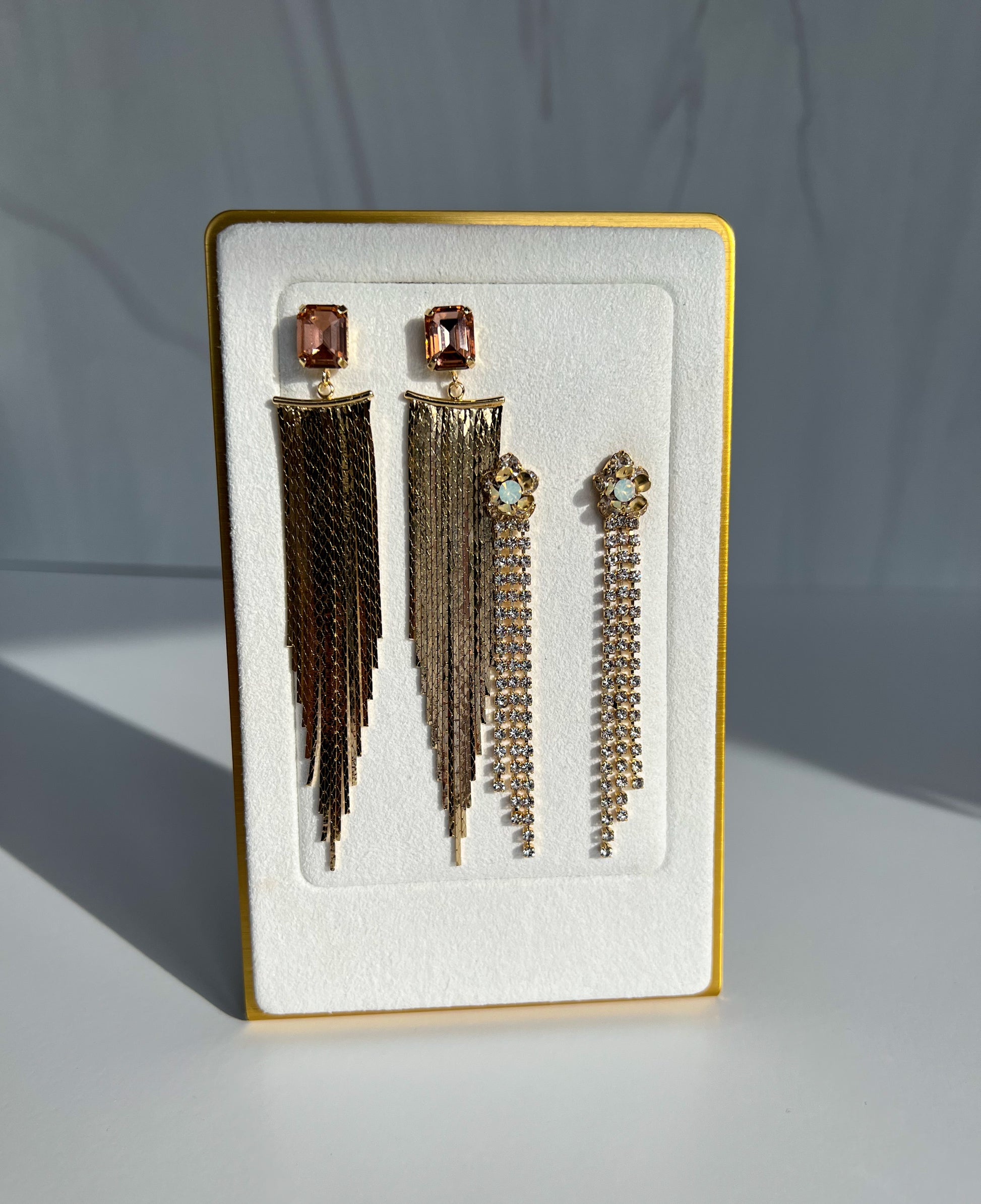 gold tassel chandelier earring. gold tassel statement earrings. trendy fringe earrings. gold fringe statement earrings. special occasion statement earrings