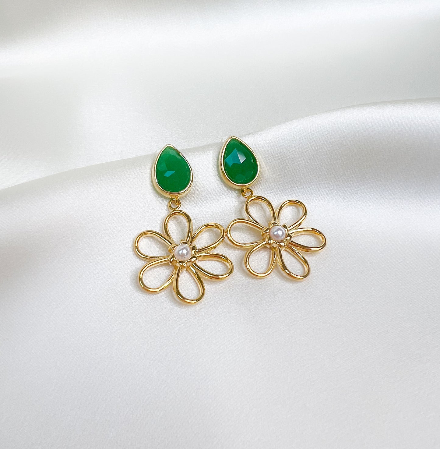 gold flower earrings. flower earrings. gold flower jewelry. emerald green earrings. gold and emerald earrings. emerald earrings. emerald green jewelry. emerald green earrings. colorful gemstone earrings. colorful statement earrings. trendy earrings. affordable fun earrings. gemstone jewelry. trendy jewelry brand. trendy earrings. trendy jewelry style