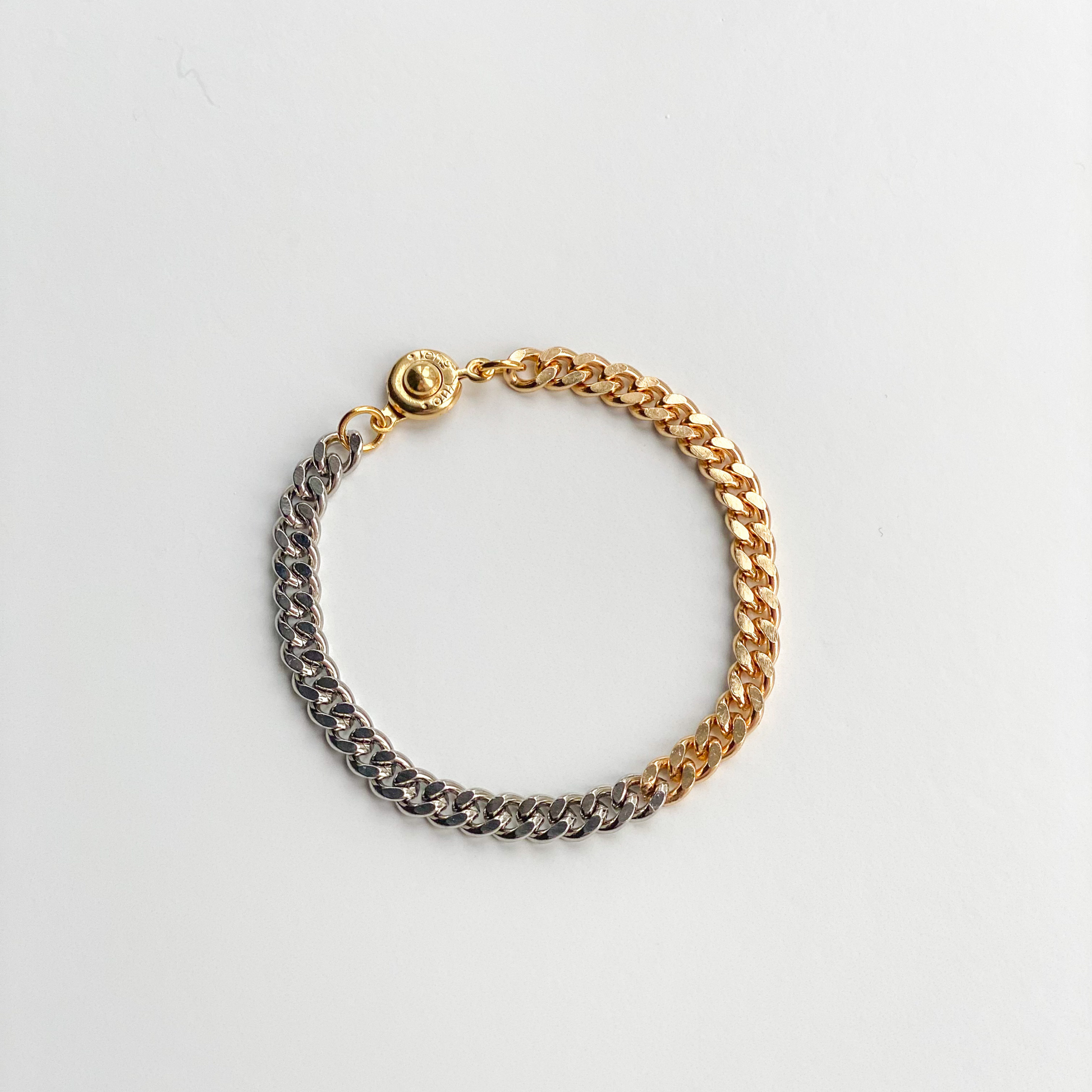 two-tone gold and silver curb chain bracelet